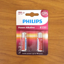 Genzy Store AA alkaline batteries 2-pack, showing silver cylindrical batteries with positive and negative terminals.